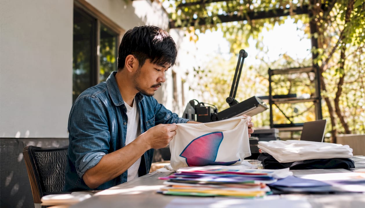 Business owner reviewing custom apparel samples
