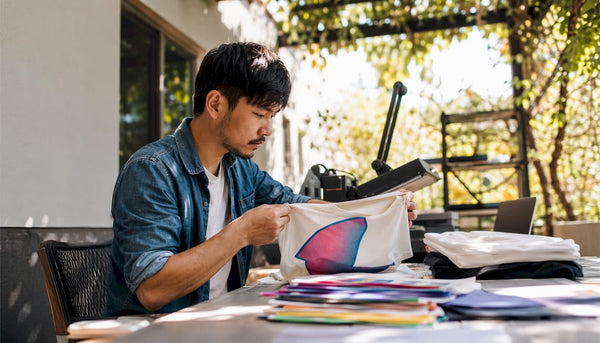 Business owner reviewing custom apparel samples